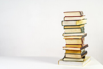 Stack of old books on white background