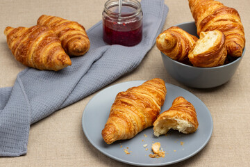 Croissants on gray plate and in bowl.