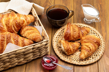 Croissants on wicker plate and in basket.