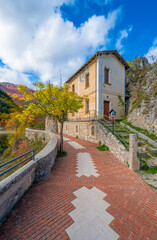 Villalago (Abruzzo, Italy) - A view of medieval village in province of L'Aquila, situated in the gorges of Sagittarius, with Lago San Domenico lake, bridge and sanctuary. Here during autumn foliage