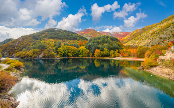 Villalago (Abruzzo, Italy) - A view of medieval village in province of L'Aquila, situated in the gorges of Sagittarius, with Lago San Domenico lake, bridge and sanctuary. Here during autumn foliage