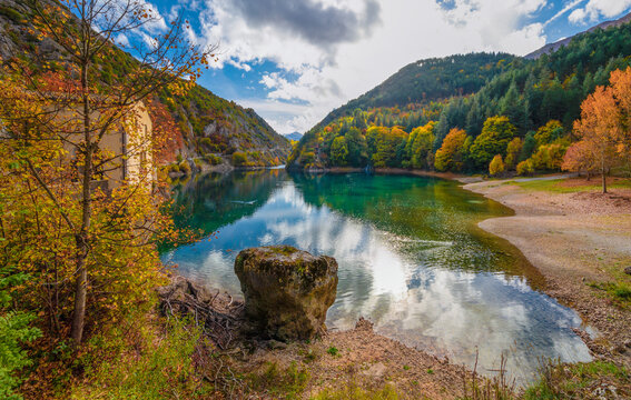 Villalago (Abruzzo, Italy) - A view of medieval village in province of L'Aquila, situated in the gorges of Sagittarius, with Lago San Domenico lake, bridge and sanctuary. Here during autumn foliage