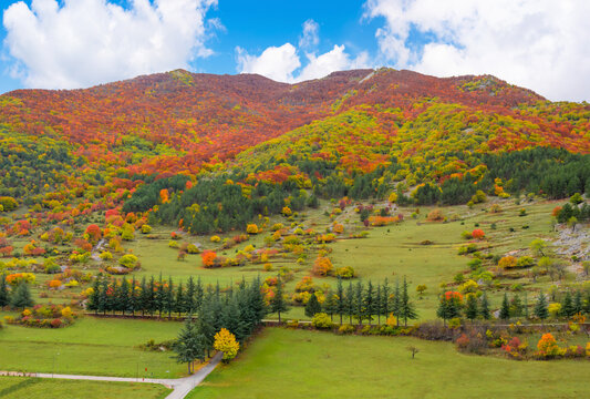 Villalago (Abruzzo, Italy) - A view of medieval village in province of L'Aquila, situated in the gorges of Sagittarius, with Lago San Domenico lake, bridge and sanctuary. Here during autumn foliage