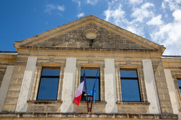 French tricolor and europa flag on mairie text building mean town hall in city center in france