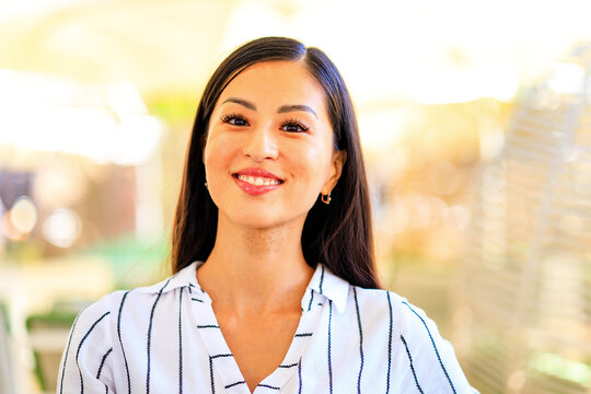 Portrait of successful business asian women in striped shirt outdoor