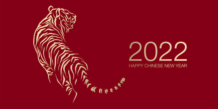 Happy Chinese New Year 2022 by gold brush stroke abstract paint of the tiger isolated on red background.
