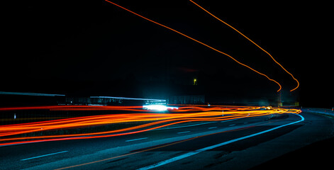 Night road lights. Lights of moving cars at night. long exposure red, blue, green