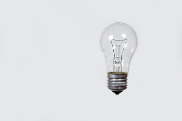 Light bulb on a gray background, banner with space for text