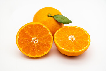Ripe tangerines on the white background.
