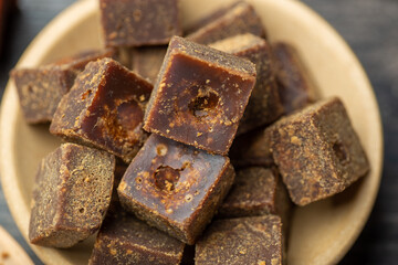 The bowl contains lumps of brown sugar