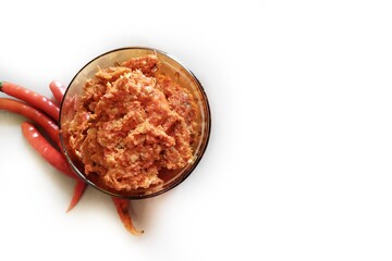 Hot and spicy Hot chilli chutney using lal mirch, cumin seeds, lemon juice and coriander. served in a bowl. Red mirchi thecha, Red mirchi kharada. Maharashtrian spicy chutney .
