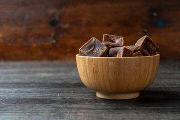 Lumpy brown sugar on a white background