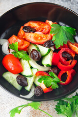 salad dried olives and vegetables a la Greek salad healthy meal food snack on the table copy space food background rustic top view keto or paleo diet veggie vegan or vegetarian food no meat