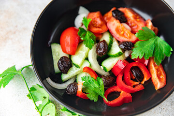 salad dried olives and vegetables a la Greek salad healthy meal food snack on the table copy space food background rustic top view keto or paleo diet veggie vegan or vegetarian food no meat