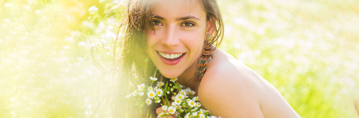 Spring woman face for banner. Portrait of a beautiful young girl in the spring with wildflowers....