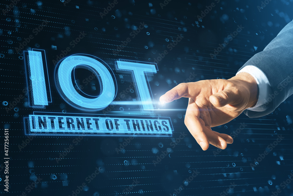 Poster close up of businessman hand pointing at abstract glowing iot hologram on blue background. internet 