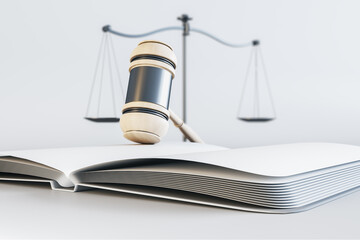 Close up of white gavel, scales and book/journal on light background. Lawyer, justice and punishment concept. 3D Rendering.
