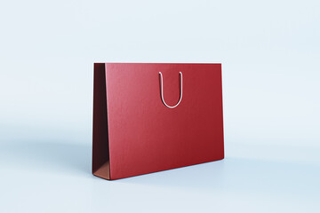 Empty red shopping bag with mock up place on white background. Christmas, present and packaging concept. 3D Rendering.
