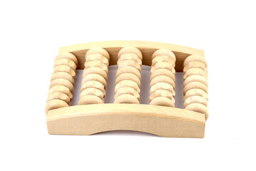 Wooden foot massage roller isolated on white