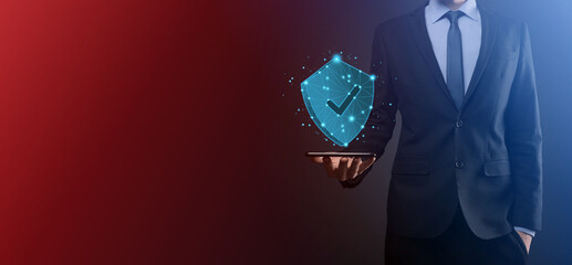 Businessman hold low poly polygon shield with a tick icon.Secure Access System Concept.Business Financial Warranty for Investment.antivirus concept.Technology security.Protection network,safe data.