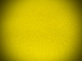 Yellow velvet fabric texture used as background. Empty yellow fabric background of soft and smooth textile material. There is space for text.