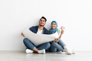 Young arab couple working on new home interior