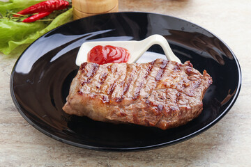 Grilled rib-eye steak beef meat