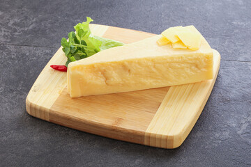 Parmesan cheese piece over board