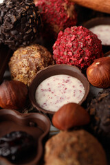 Tasty chocolate candies all over background, close up