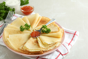 Concept of tasty food with crepes on gray textured background