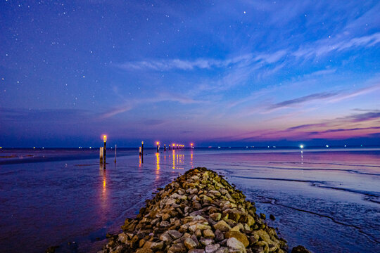 Dusk moments at a breakwater