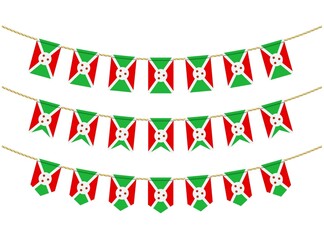 Fototapeta premium Burundi flag on the ropes on white background. Set of Patriotic bunting flags. Bunting decoration of Burundi flag