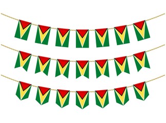 Obraz premium Guyana flag on the ropes on white background. Set of Patriotic bunting flags. Bunting decoration of Guyana flag