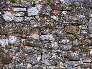 The texture of a natural stone wall. Background image
