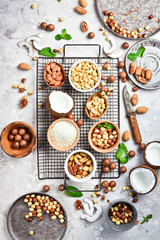 Background with nuts on a stone table. Assortment of nuts. Top revision.