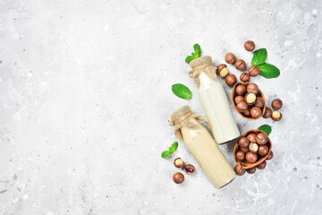 Macadamia. Milk is made from macadamia nuts. On a stone background. Top view. Free space for text.