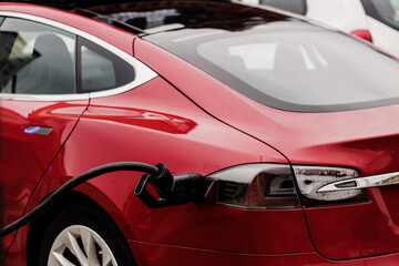 Fototapeta premium Charging an electric car