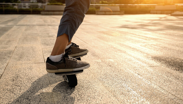 Freeline skateboarder legs skateboarding at city