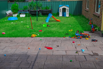 toys spread all over a suburban Sydney backyard NSW Australia