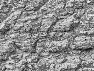 The texture of a natural stone wall. Background image