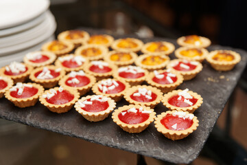 Tartlets with jam on banquet table