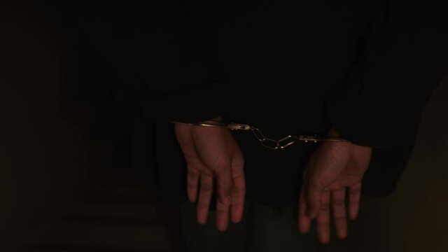 Woman handcuffed and brought out of the Crime Scene. Woman offender