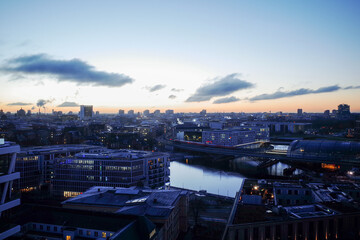 Cityscape view at dawn over Berlin, Germany. Berlin Central Station, government district, Reichstag and river Spree in the background.