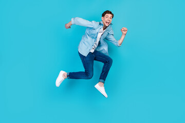 Fototapeta na wymiar Full size profile side photo of young cheerful man good mood run fast discount isolated over blue color background