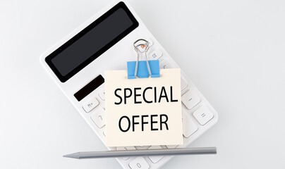 SPECIAL OFFER text on the sticker on white calculator
