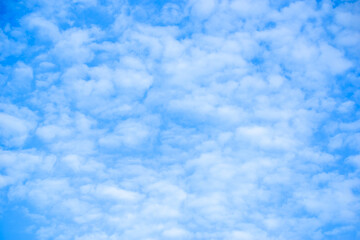 Blue sky, background with clouds.