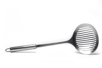 Closeup dripping ladle pan turner white background