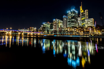 Fototapeta na wymiar The skyline of Frankfurt - Main at night at a cold day in winter.