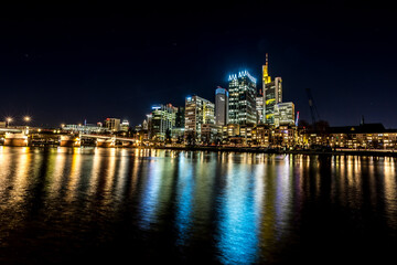 Fototapeta na wymiar The skyline of Frankfurt - Main at night at a cold day in winter.