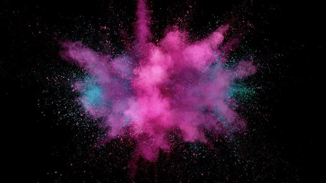 Super slow motion of colored powder explosion isolated on black background. Speed ramp effect. Filmed on high speed cinema camera, 1000fps.
